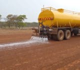 EBS Surface Seal application with specialized spray bar Tulawaka airstrip EBS Surface Seal application